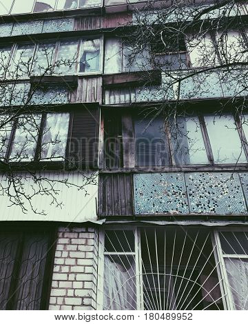 Old building with color bright windows in rural area