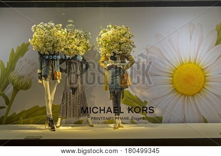 PARIS FRANCE - MARCH 27 2017: Mannequins in the showcase of the Printemps department store in Paris France. Spring and summer theme.