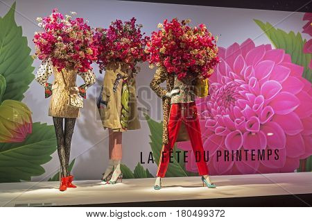 PARIS FRANCE - MARCH 27 2017: Mannequins in the showcase of the Printemps department store in Paris France. Spring and summer theme.