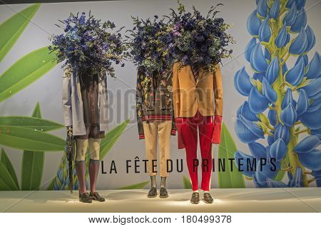PARIS FRANCE - MARCH 27 2017: Mannequins in the showcase of the Printemps department store in Paris France. Spring and summer theme.