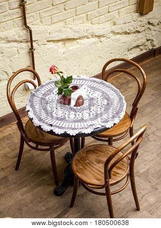 Street cafe with a rose on the table