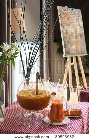 Fresh juice on a table in a restaurant. Healthy carrot drink.