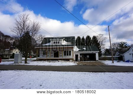 HARBOR SPRINGS, MICHIGAN / UNITED STATES - NOVEMBER 21, 2016: A home under construction on Washington Street in Harbor Springs.