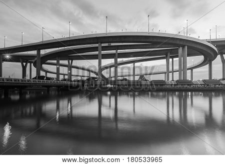 Black and White Round highway overpass interchanged river front and reflection
