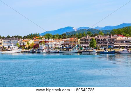 Keramoti, Greece - May 1, 2016: Keramoti port and town panorama with houses and boats