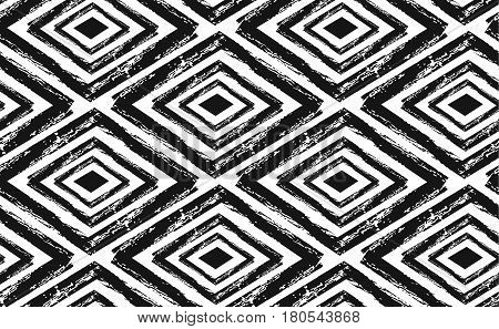 Hand drawn vector abstract rought hand made rhombus seamless pattern in black and white colors.Tribal ethnic ornament decoration.Freehand textures.Unusual universal pattern.