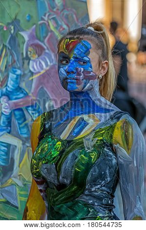 TIMISOARA ROMANIA - MARCH 31 2017: Face and body painting of a woman. 3D art symbolizing on live at the street inside the CheckART Carnival organized by the City Hall Timisoara. Liberty Square.