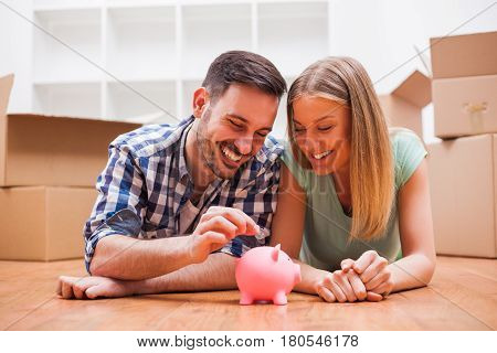 Young couple is saving money for their new home.