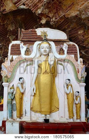 Ancient Buddha statue inside sacred Kaw Gun Cave in Kayin State Hpa An Myanmar.