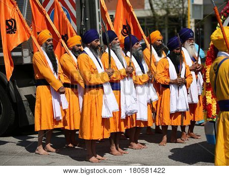 Vicenza, Vi, Italy - April 8, 2017: Men With Turbans Sikh Religious Procession With  Ceremonial Scim