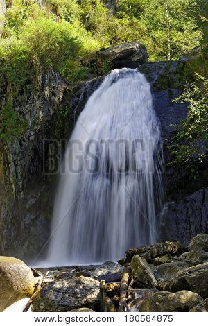 Russia Siberia. Korbu waterfall in the Altai in summer