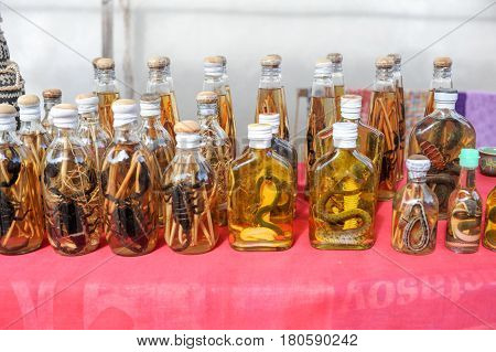 Liquor with snake and scorpion inside on a market on Laos