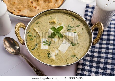 methi malai paneer or Creamy Fenugreek & Paneer Curry, popular north indian recipe prepared using milk cream, methi and paneer or cottage cheese, served with roti/paratha, selective focus