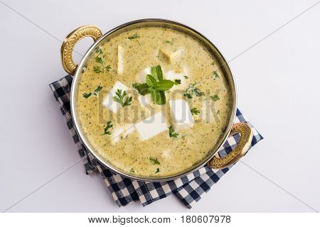 methi malai paneer or Creamy Fenugreek & Paneer Curry, popular north indian recipe prepared using milk cream, methi and paneer or cottage cheese, served with roti/paratha, selective focus
