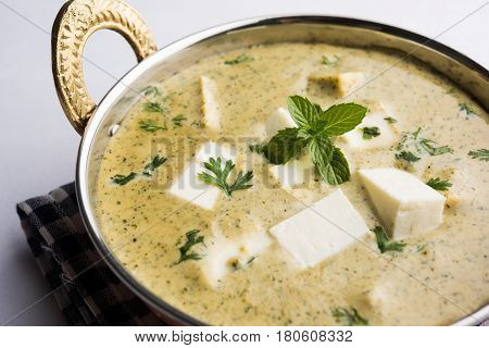methi malai paneer or Creamy Fenugreek & Paneer Curry, popular north indian recipe prepared using milk cream, methi and paneer or cottage cheese, served with roti/paratha, selective focus