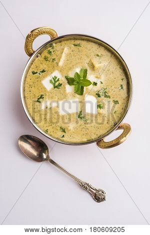methi malai paneer or Creamy Fenugreek & Paneer Curry, popular north indian recipe prepared using milk cream, methi and paneer or cottage cheese, served with roti/paratha, selective focus