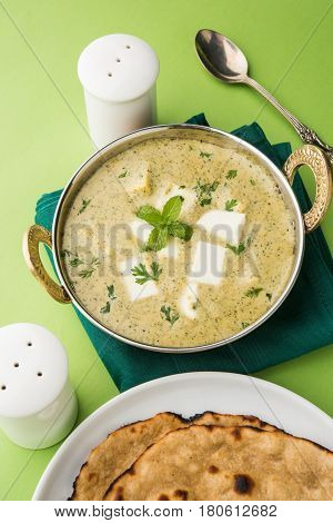 methi malai paneer or Creamy Fenugreek & Paneer Curry, popular north indian recipe prepared using milk cream, methi and paneer or cottage cheese, served with roti/paratha, selective focus