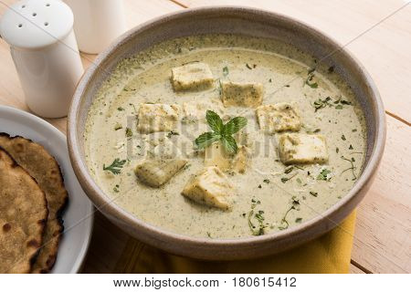 methi malai paneer or Creamy Fenugreek & Paneer Curry, popular north indian recipe prepared using milk cream, methi and paneer or cottage cheese, served with roti/paratha, selective focus