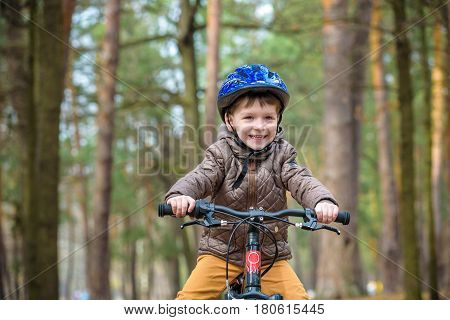 Happy Kid Boy Of 3 Or 5 Years Having Fun In Autumn Forest With A Bicycle On Beautiful Fall Day. Acti