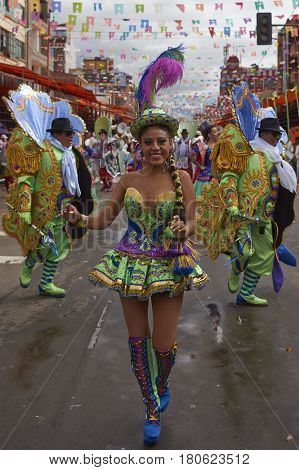ORURO, BOLIVIA - FEBRUARY 26, 2017: Morenada dance group in colourful outfits parading through the mining city of Oruro on the Altiplano of Bolivia during the annual Oruro Carnival.