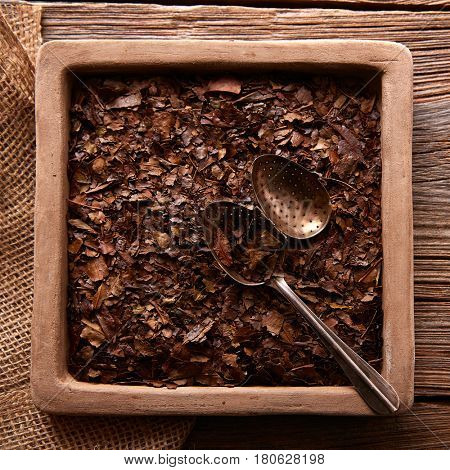 Bancha tea texture on wooden aged background