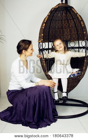 young mother with daughter at luxury home interior vintage, old fashion relashionship family