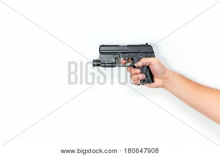 Male Hand Hold Pistol Gun Or Automatic Handgun  From Side Isolated On White. Shooting Posture.