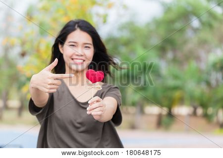Asian Woman Hand Hold Beautiful Red Heart Sweet Loving Symbol Of Take Care Or Charity Help To You.