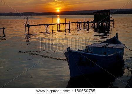 Old boat in sunset on Varna Lake