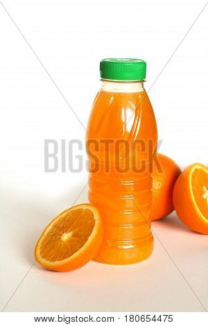 Bottle Of Orange Juice And Oranges