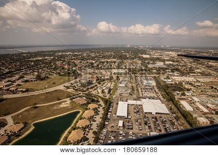 Aerial view of the metropolis Fort Myers and Cape Coral in south Florida. Typical houses with swamps and access across the channel to the sea. Florida. USA