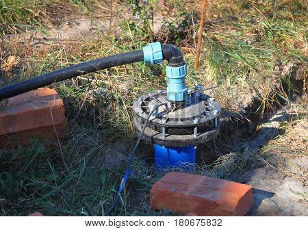 New Installed Water Bore. Pumping air from compressor into from new constructed water bore or well as process of cleaning and filtrating water.