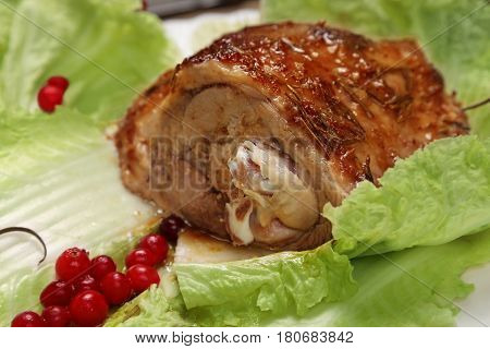 Roasted turkey cutted off leg with cranberry rosemary and spices. Fowl meat. Fresh meal. Close up view.