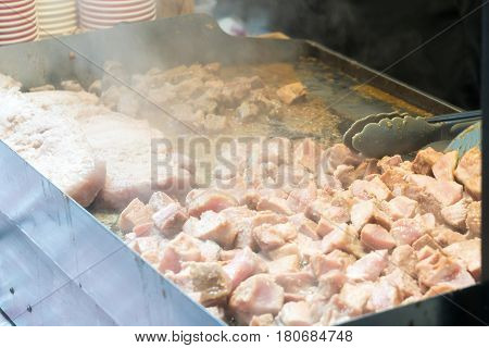 Steaming grilled pork on teppanyaki fry pan
