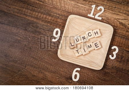 Lunch time wooden alphabet with number of clock. Lunch time concept.