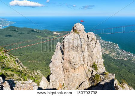 The rock with a rope bridge on the Mount Ai-Petri. Ai-Petri is one of the highest mountains in Crimea and tourist attraction.