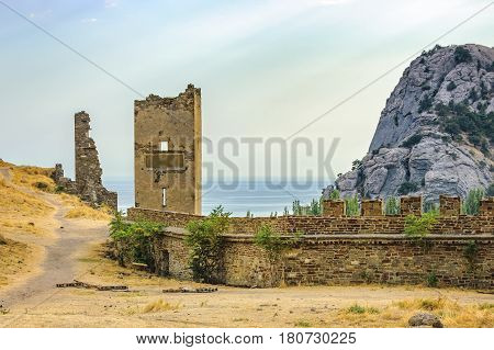 Walls of Genoese fortress in Sudak Crimea. Scenic views of rocky cliffs near ancient Genoese fortress and the Black Sea