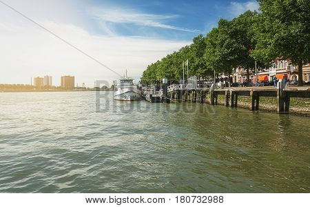Rotterdam Netherlands - August 18 2016: Motorboat docked along the quay in Rotterdam.