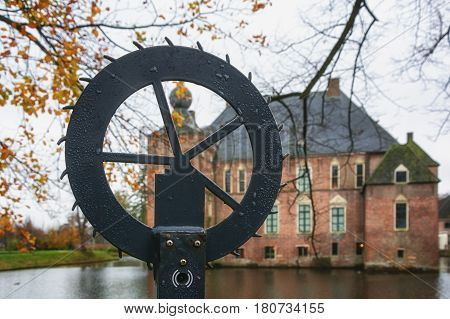 Cannenburgh Castle is a 16th century castle in Vaassen in the Dutch province of Gelderland with in the foregrond the wind work of a lock