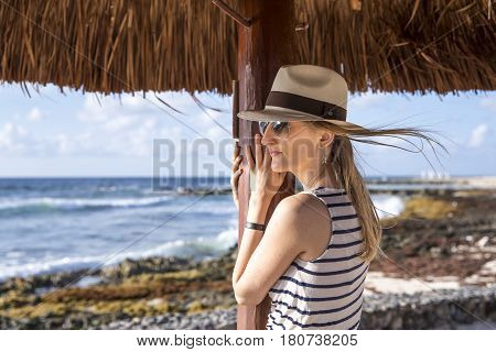Young Woman In Panama Hat  Looking At A Sea