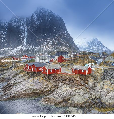 Travel Concepts and Ideas. Traditional Fishing Hut Village in Hamnoy Mountain Peak in Lofoten Islands Norway. Square Image Composition