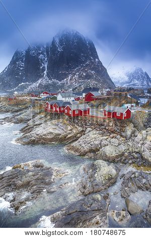 Travel Concepts and Ideas. Traditional Fishing Hut Village in Hamnoy During Early Spring Time in Lofoten Islands Norway. Vertical Image