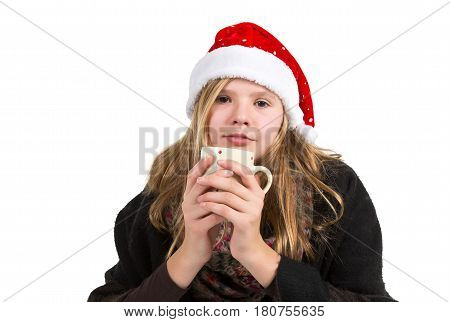Young girl with black cape and red winter cap holding cup isolated on white background