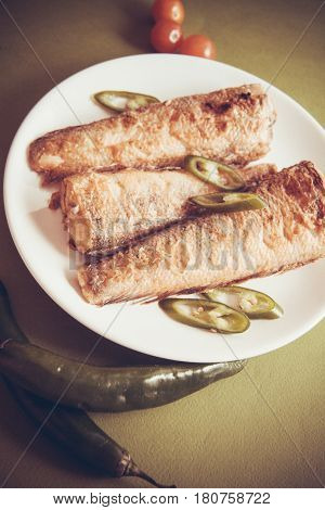 fried shad with chilli, australian fish on plate