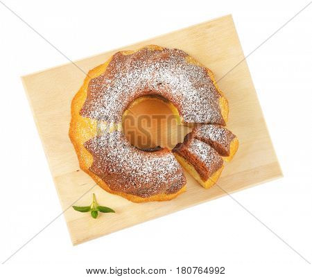 marble bundt cake on cutting board, two slices cut off