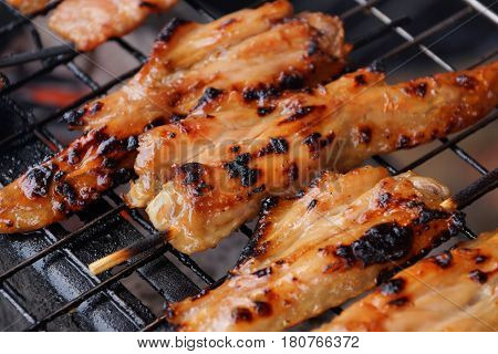 Grilled chicken wings on the tray / street food