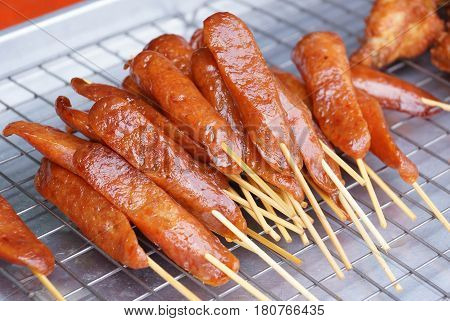 A pile of Grilled Chinese Sausage on the tray