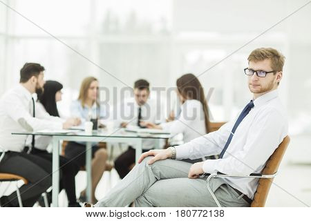 leading specialist company in the background of the business team. the photo has a empty space for your text.