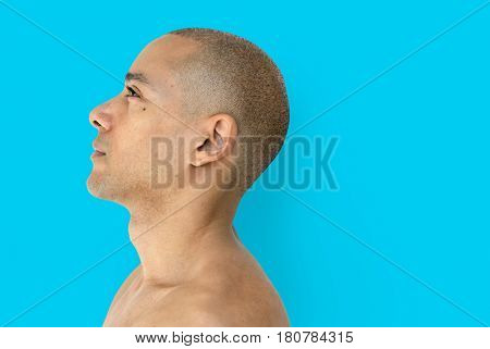 A skinhead guy is in a studio shoot