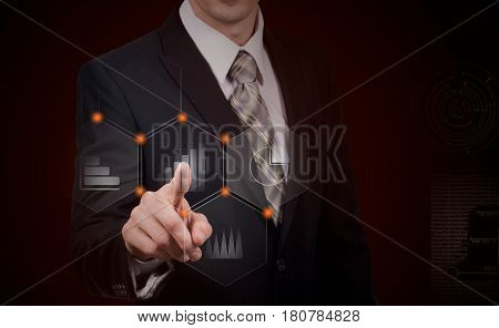business, cyberspace and future technology concept - close up of businessman in suit working with virtual charts over dark background.